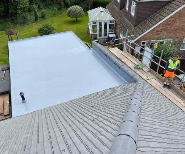 This is a photo of a newly installed hip roof, with a combined liquid covered flat roof. Work carried out by SCG Roofing Earls Barton